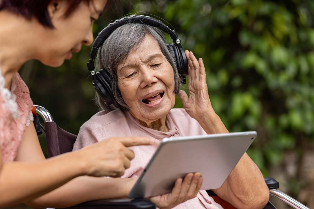 Older lady with headphones