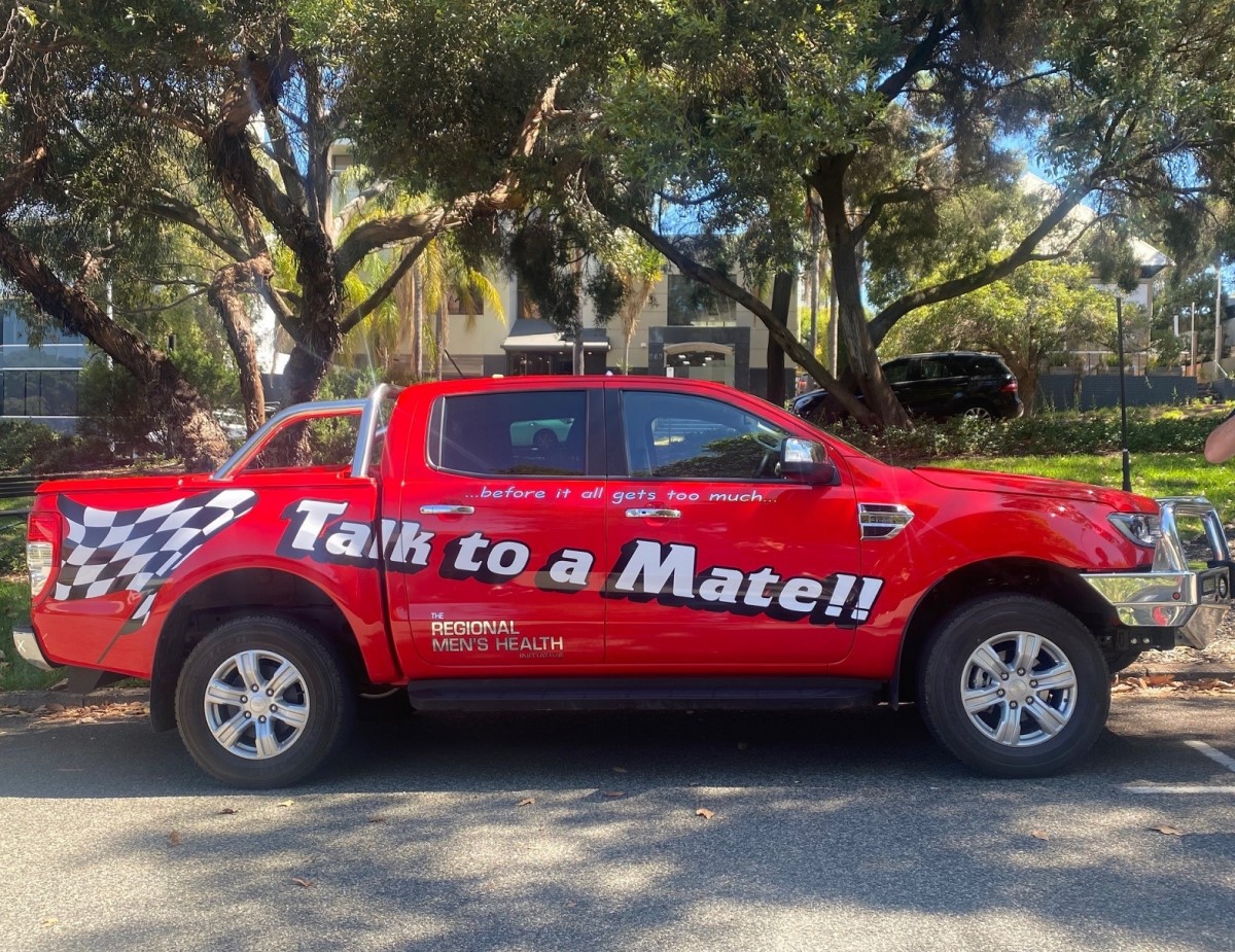 Red ute with talk to a mate written on it